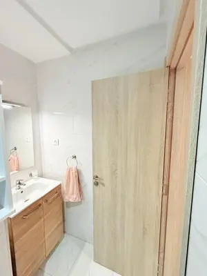 a bathroom with a shower and a sink at STUDIO luxueux COSY FAMILY in Marrakech