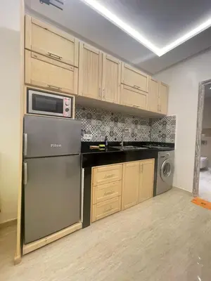 a kitchen with a refrigerator and a microwave at Neuf appartement a marrakech in Marrakech