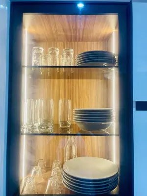 a cabinet filled with plates and glasses and dishes at Appartement à Marrakech in Marrakech