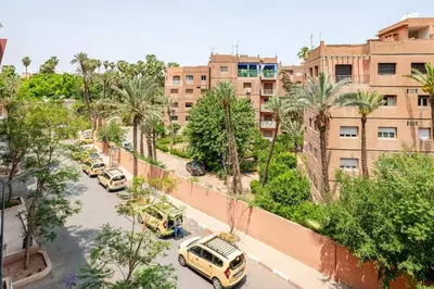 an overhead view of a street with parked cars and buildings at Sojori Majorelle piscine et parking in Marrakech