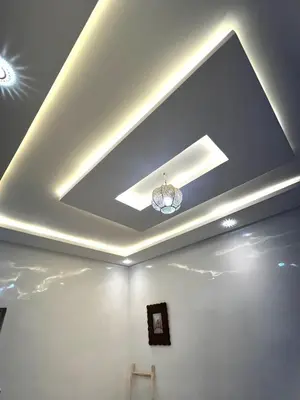 a ceiling with a light in a room at Dar Nahila Appartement Aéroport in Marrakech