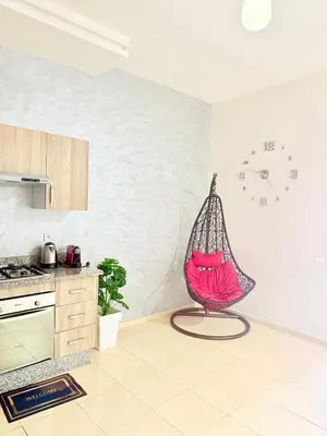 a kitchen with a hammock in the corner of a room at Charmant Studio B5 & Bel Terrasse in Marrakech