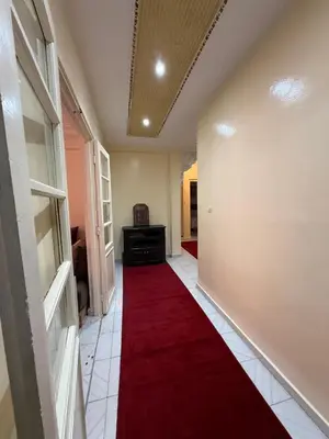 a hallway with a red carpet on the floor at Appartement Salia à Guéliz Marrakech in Marrakech