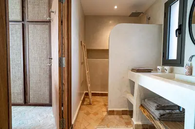 a bathroom with a sink and a mirror at Villa 61 in Marrakech