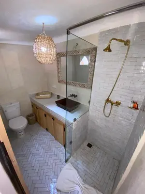 a bathroom with a shower and a sink and a toilet at Riad Dar Khalti Privatisation in Marrakech
