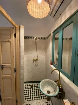 a bathroom with a sink and a shower at Riad Dar Khalti Privatisation in Marrakech