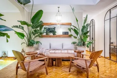 a dining room with a table and chairs and plants at Riad Nayl Medina & Spa in Marrakech