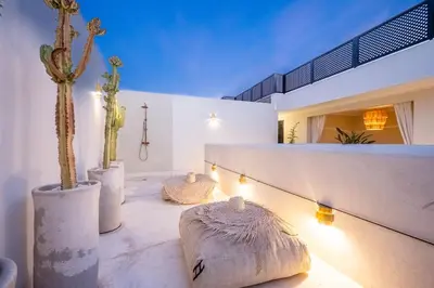 a room with three cactuses and a couch at Riad Nayl Medina & Spa in Marrakech