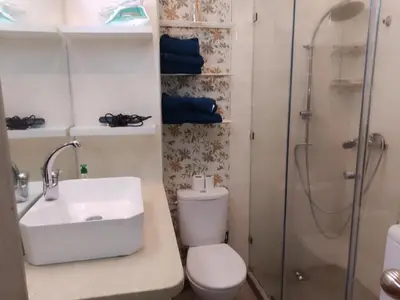 a bathroom with a toilet and a sink and a shower at Appartement aux portes de Marrakech in Marrakech