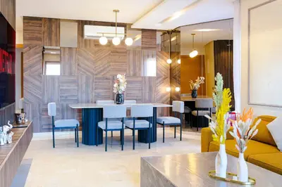 a living room with a table and chairs at Crystal Luxury Marrakech Prestigia in Marrakech