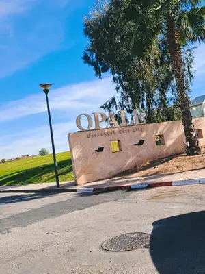 a sign for an oregon state park with a street light at Appartement Marrakech golfe in Marrakech