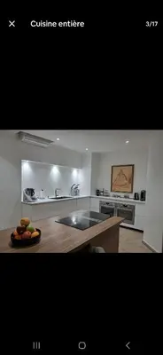a kitchen with a table with a plate of fruit on it at Magnifique appartement in Marrakech