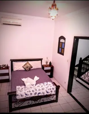 a bedroom with a bed in a room at LOGEMENT ENTIER MARRAKECh G1 - N3 in Marrakech