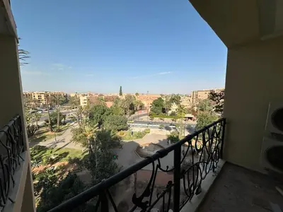a balcony with a view of a city at Duplex à l hivernage in Marrakech