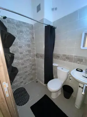 a bathroom with a toilet and a sink at Appartement au Cœur de Guéliz in Marrakech