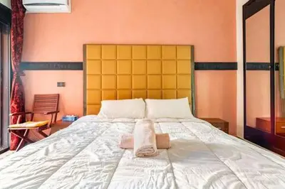 a bed with two towels sitting on top of it at Havre de paix in Marrakech