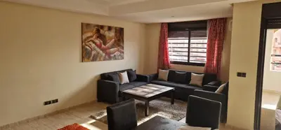 a living room with a couch and a table at Havre de paix in Marrakech