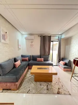 a living room with a couch and a coffee table at Calm apartment 10 min from Majorelle Garden in Marrakech