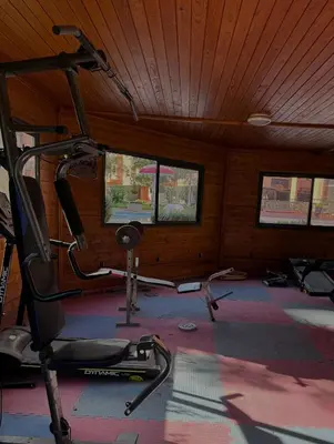 a room with a gym with a treadmill at RENTSUITE APPARTEMENT Premium Village Luxurious Residence in Marrakech