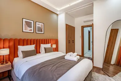 a bedroom with a large bed with two towels on it at Serenite tranquille au coeur du centre ville in Marrakech