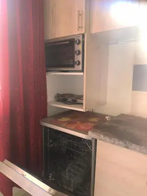 a kitchen with an oven and a microwave at المنتزه الجديد in Marrakech