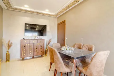 a dining room with a table and chairs at luxury appartement near gueliz voyageurs in Marrakech
