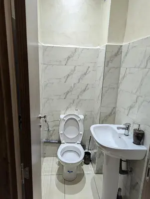 a bathroom with a toilet and a sink at luxury appartement near gueliz voyageurs in Marrakech