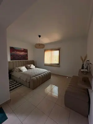 a living room with a bed and a couch at Apartment Gueliz Victor Hugo in Marrakech