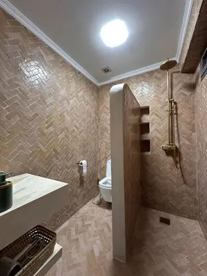a bathroom with a tub and a toilet and a sink at Apartment Gueliz Victor Hugo in Marrakech