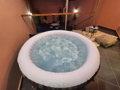 a jacuzzi tub in the middle of a room at El Méhénni Guéliz JACUZZI 6 Personnes Terrasse Privative in Marrakech