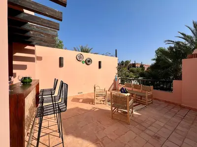 a patio with chairs and a table on a patio at Riad in Hotel M Avenue in Marrakech