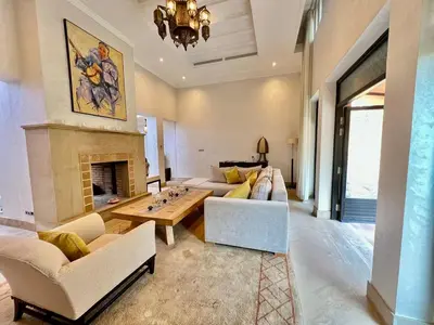 a living room with couches and a fireplace at Riad in Hotel M Avenue in Marrakech