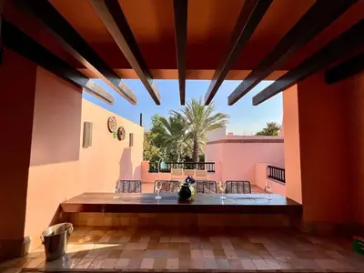 a patio with a table and chairs in a building at Riad in Hotel M Avenue in Marrakech