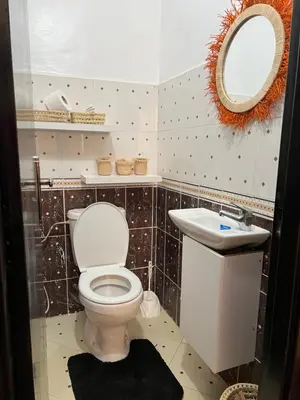 a bathroom with a toilet and a sink at Aeroport appartement in Marrakech