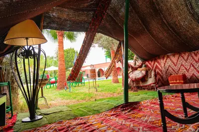 a room with a tent with a table and chairs at Tente berbère in Marrakech