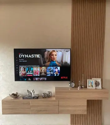 a flat screen tv on a wall at Luxueux appartement a Marrakech in Marrakech