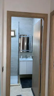 a bathroom with a sink and a mirror at Kech Aliouni in Marrakech