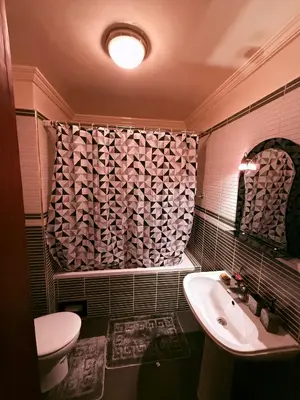 a bathroom with a sink and a toilet and a shower curtain at Heart of Marrakech in Marrakech