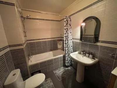 a bathroom with a sink and a toilet and a tub at Heart of Marrakech in Marrakech