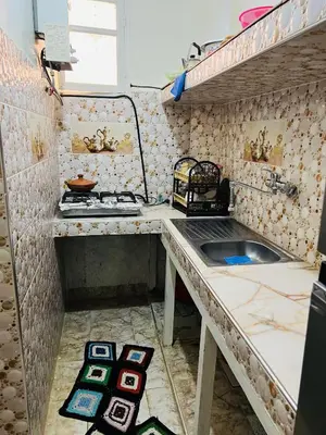 a small kitchen with a sink and a stove at Angel 12 minutes from Marrakech airport in Marrakech