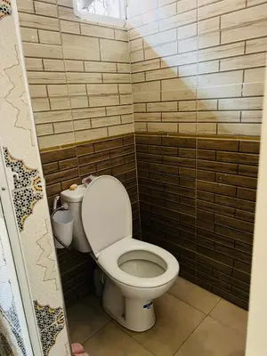 a bathroom with a toilet in a small room at Angel 12 minutes from Marrakech airport in Marrakech