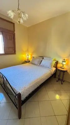 a bedroom with a large bed in a room at Appartement, Marrakech cosy & traditionnel in Marrakech