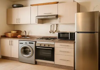 a kitchen with a stainless steel refrigerator and a dishwasher at Appart Opera Prestige Détente Moderne in Marrakech