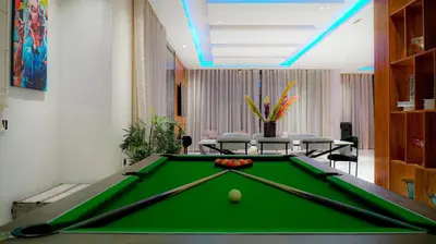 a pool table in a room with a pool ball at Villa contemporaine in Marrakech