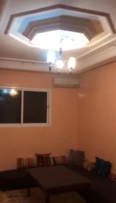 a living room with a ceiling with a window and a couch at marrakech residential in Marrakech