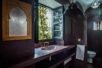 a bathroom with a sink and a window at Riad El Ayadi, Moorish villa in Marrakech