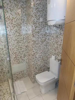 a bathroom with a toilet and a shower at Studio lumineux pour location journalière in Marrakech