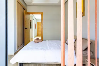 a bedroom with a bunk bed with a ladder at Central Marrakesh Apartment in Marrakech