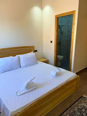 a bedroom with a bed with two towels on it at villa soufia in Marrakech