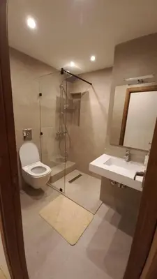 a bathroom with a toilet and a shower and a sink at Appartement proche Gueliz in Marrakech